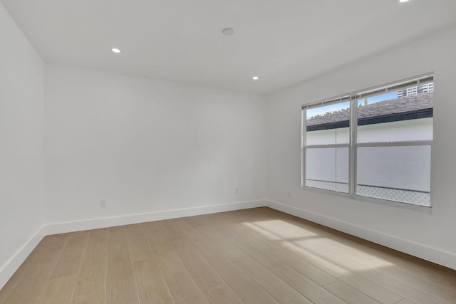 spare room featuring light hardwood / wood-style flooring