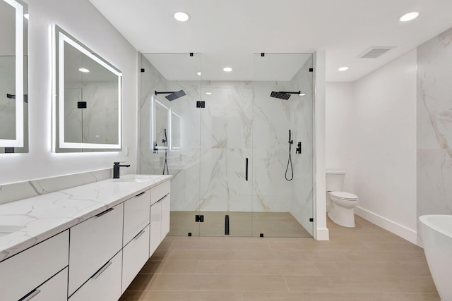 bathroom with walk in shower, vanity, and toilet