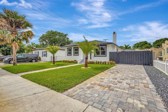 ranch-style house with a front yard