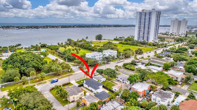 birds eye view of property with a water view