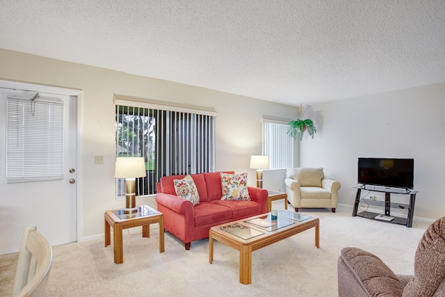 living room featuring a textured ceiling and light colored carpet