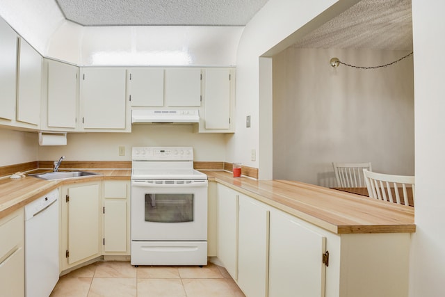 kitchen featuring light tile patterned flooring, white cabinetry, sink, a textured ceiling, and white appliances