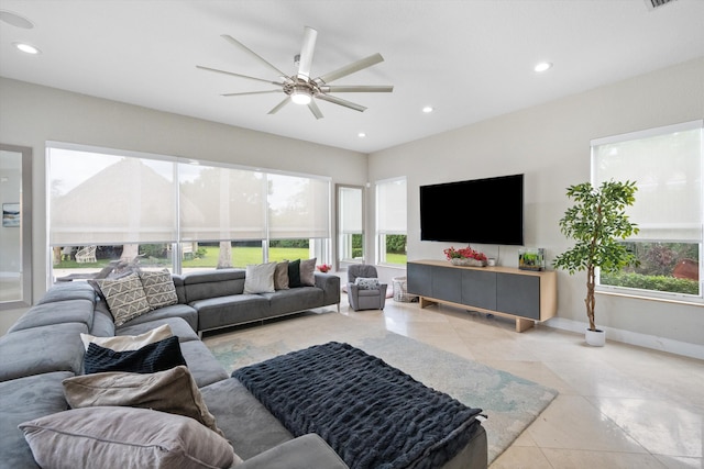 tiled living room featuring ceiling fan