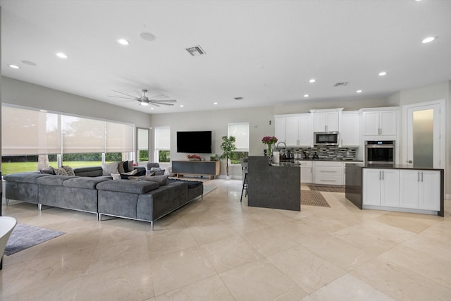 living room with ceiling fan