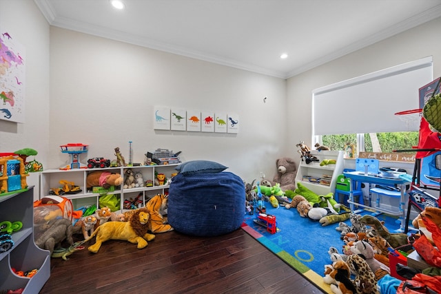 game room featuring wood-type flooring and crown molding