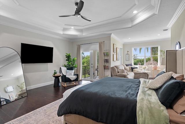 bedroom featuring ceiling fan, access to exterior, a tray ceiling, crown molding, and dark hardwood / wood-style flooring