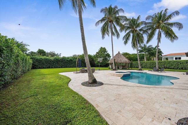 view of swimming pool with a patio, a yard, and a gazebo