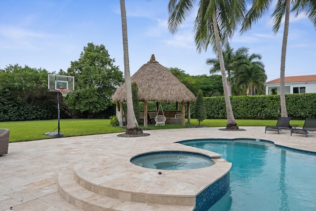 view of swimming pool featuring a patio, a lawn, a gazebo, and an in ground hot tub