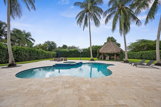 view of pool with a patio, an in ground hot tub, and a gazebo