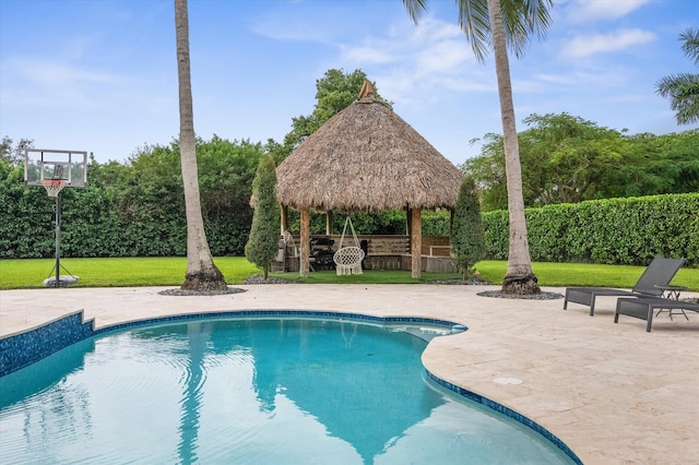 view of pool with a patio, a lawn, and a gazebo