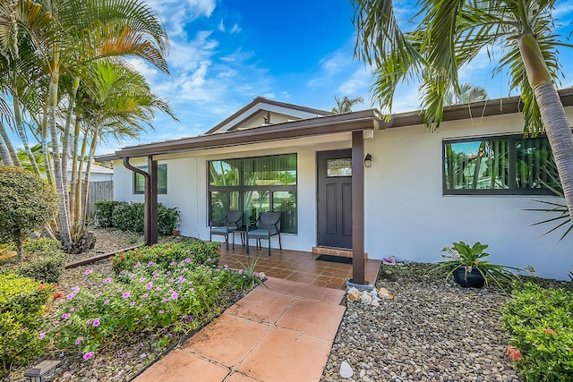 doorway to property featuring covered porch