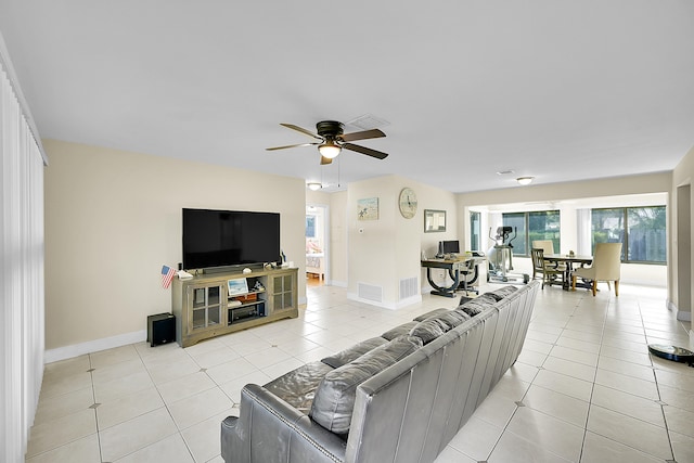 tiled living room featuring ceiling fan