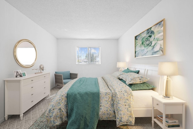 carpeted bedroom with a textured ceiling