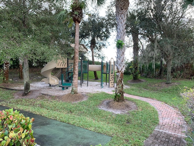 view of jungle gym with a lawn