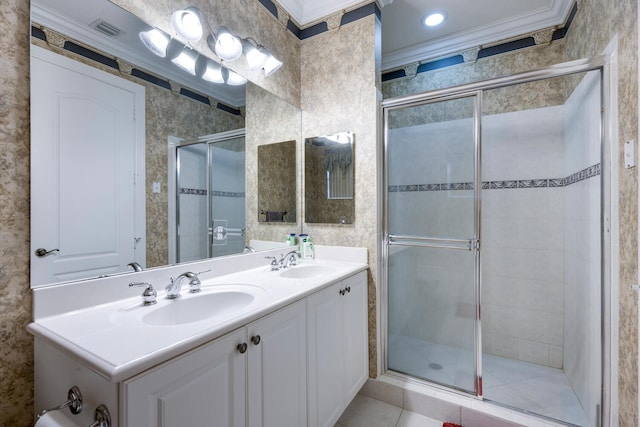 bathroom featuring ornamental molding, vanity, tile patterned floors, and a shower with door