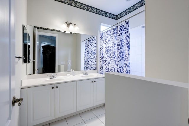 bathroom featuring a shower with curtain, tile patterned flooring, and vanity