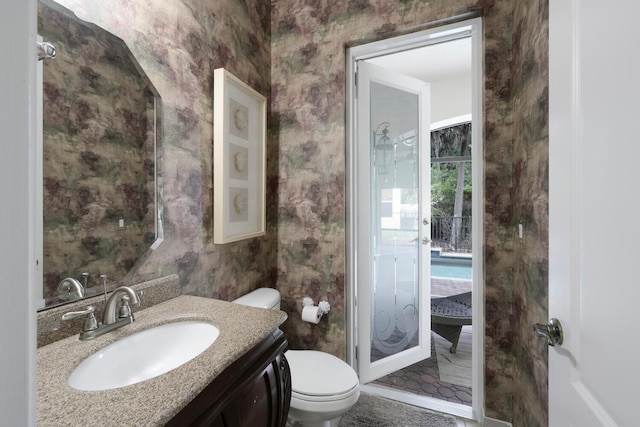 bathroom with vanity and toilet