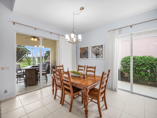 tiled dining area with ceiling fan with notable chandelier