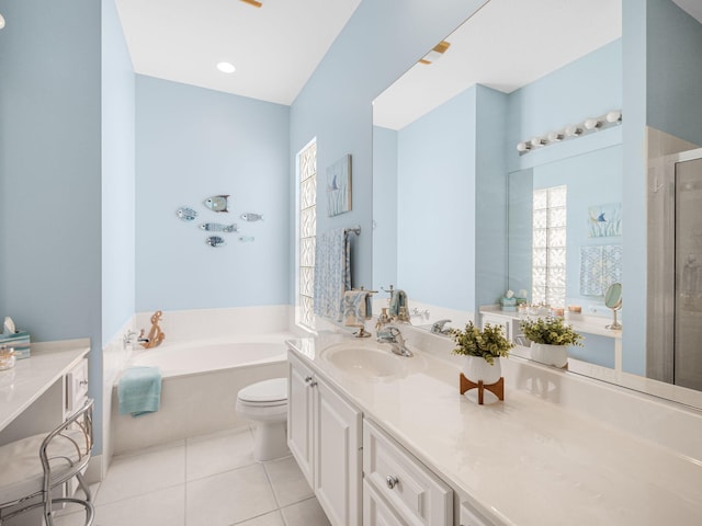 full bathroom featuring toilet, shower with separate bathtub, vanity, and tile patterned floors