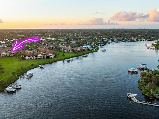 aerial view at dusk with a water view