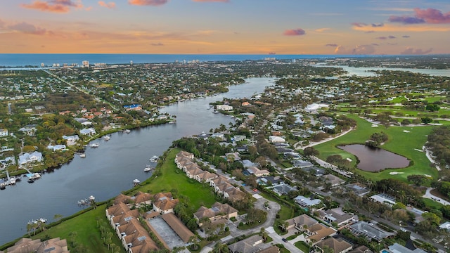 aerial view at dusk with a water view