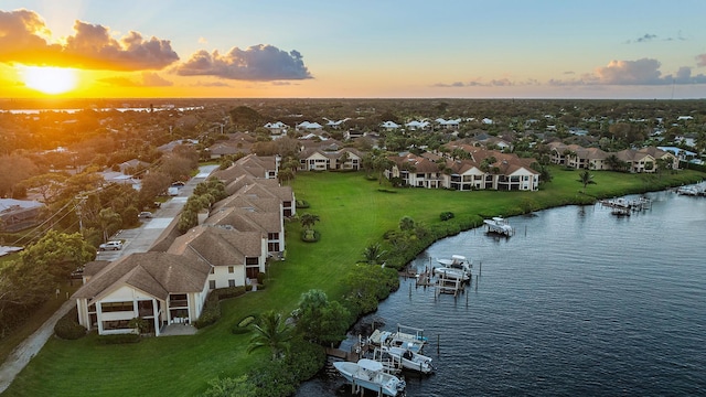 aerial view at dusk with a water view