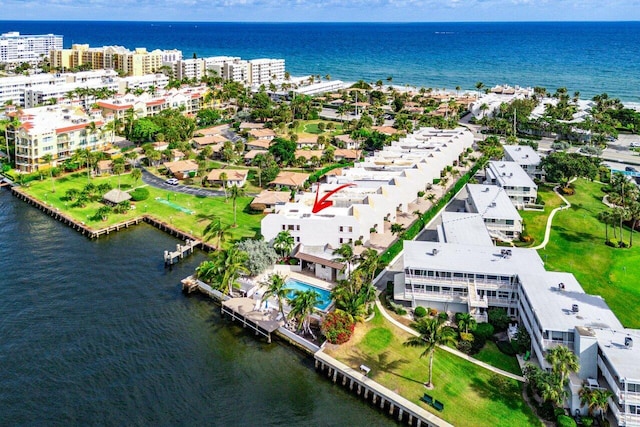 drone / aerial view with a water view and a view of the beach