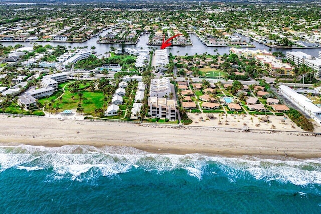 bird's eye view featuring a water view and a view of the beach