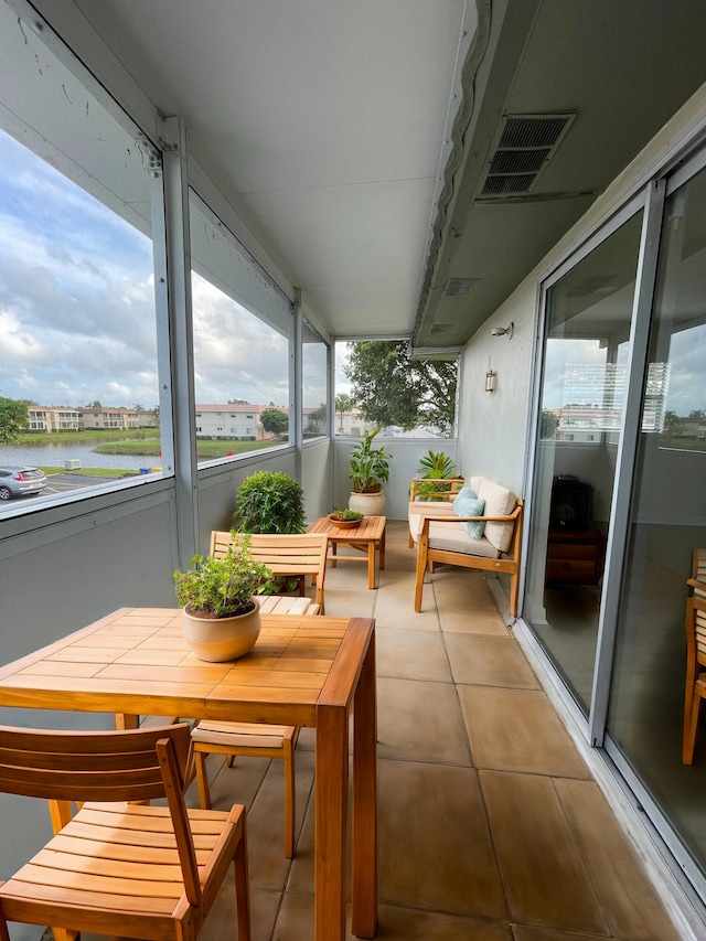 sunroom with a water view