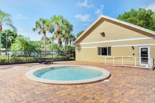 view of swimming pool with a patio area