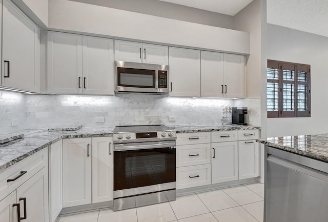 kitchen with white cabinetry and appliances with stainless steel finishes