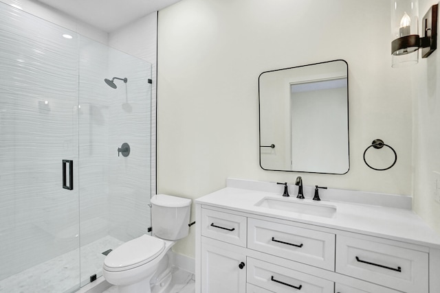 bathroom featuring vanity, toilet, and a shower with shower door