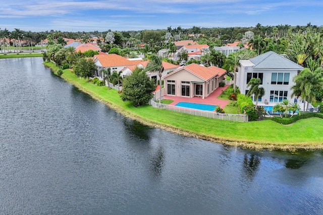 birds eye view of property with a water view