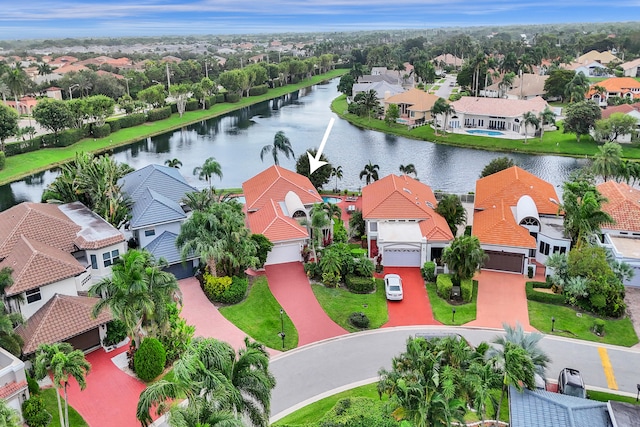 birds eye view of property with a water view