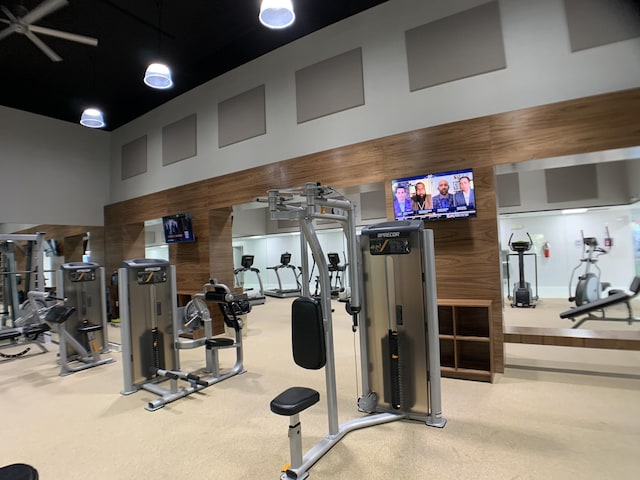 17264 Hampton Blvd, Boca Raton, FL 33496 - workout area featuring a towering ceiling and wood walls
