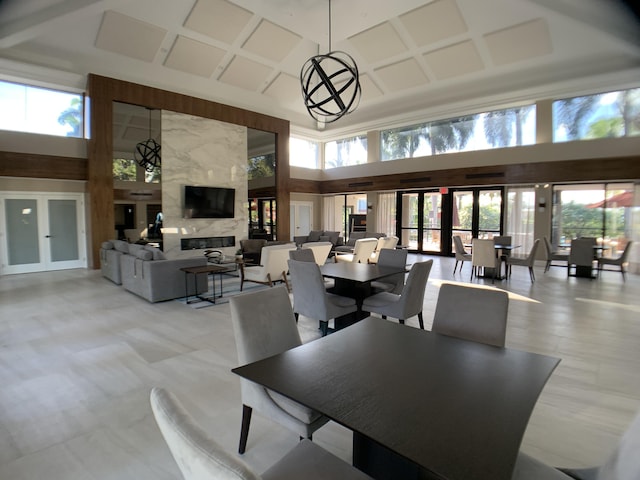 17264 Hampton Blvd, Boca Raton, FL 33496 - dining area with a towering ceiling, healthy amount of natural light, and a fireplace