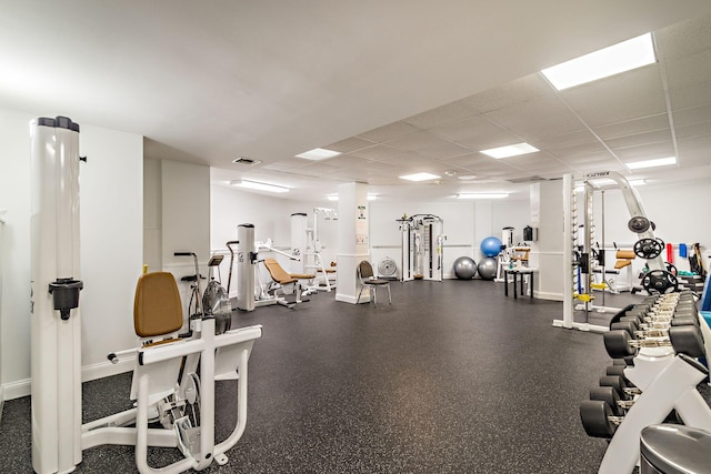 workout area with a paneled ceiling