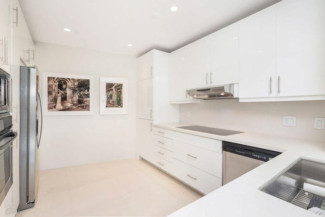 kitchen with white cabinetry, light tile patterned flooring, and stainless steel appliances