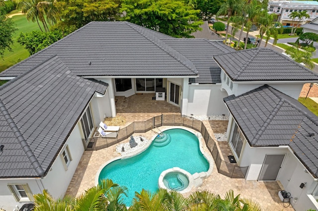 view of pool featuring an in ground hot tub and a patio area