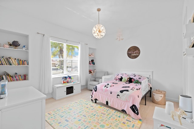 bedroom with light hardwood / wood-style floors