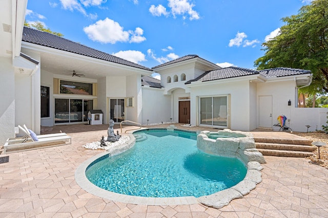 view of swimming pool with ceiling fan and a patio area