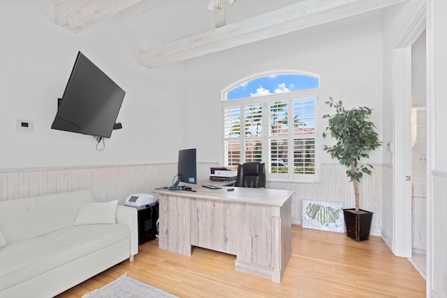 office area featuring beamed ceiling and light hardwood / wood-style flooring