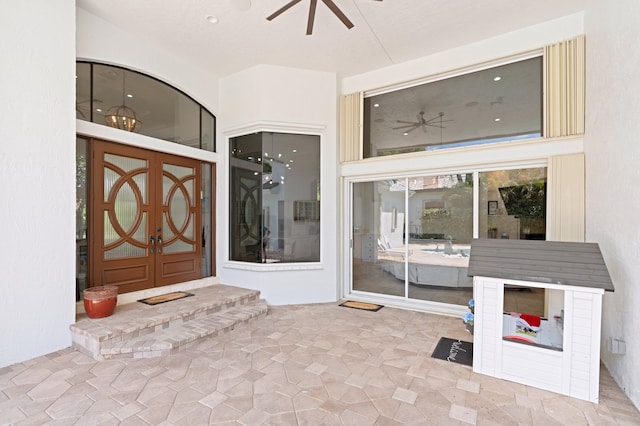 property entrance featuring ceiling fan