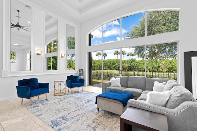 sunroom / solarium featuring ceiling fan