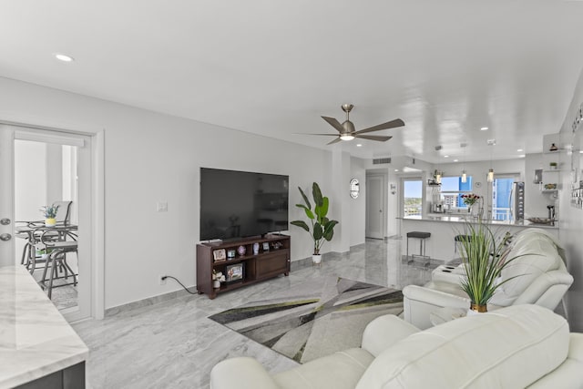 living room featuring ceiling fan