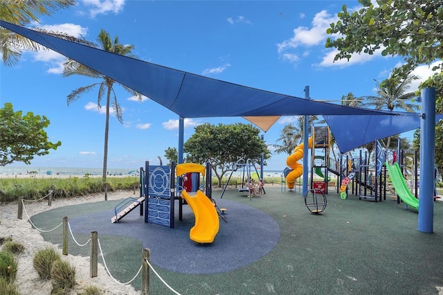 view of playground with a water view