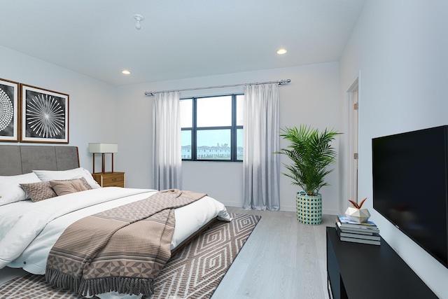 bedroom with light hardwood / wood-style floors