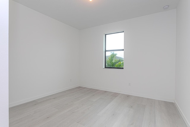 spare room with light wood-type flooring