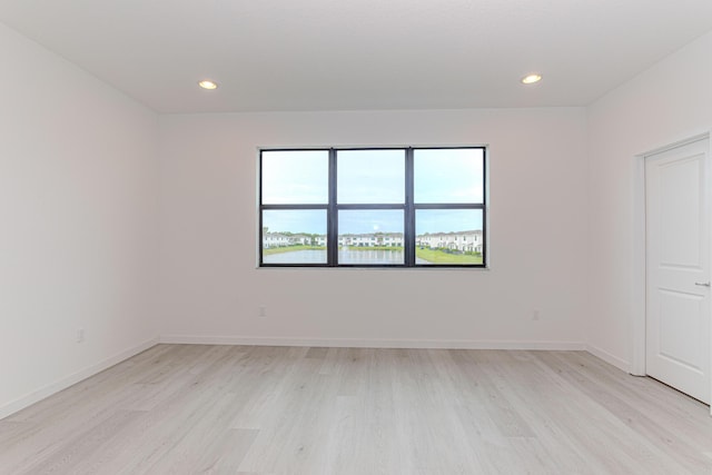 spare room featuring light hardwood / wood-style floors