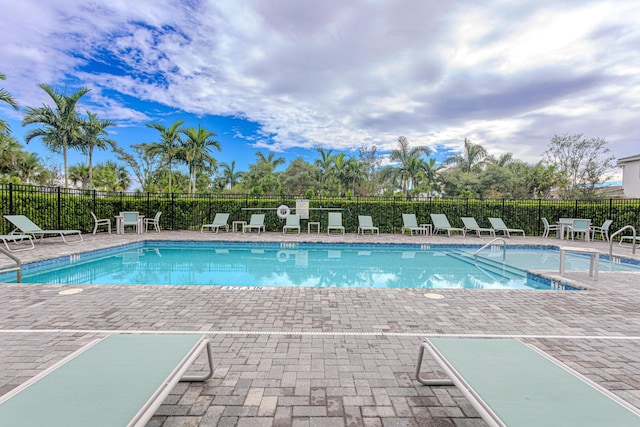 view of swimming pool with a patio area